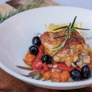 Aromatic Chicken served on a bed of bell chargrilled peppers and black olives
